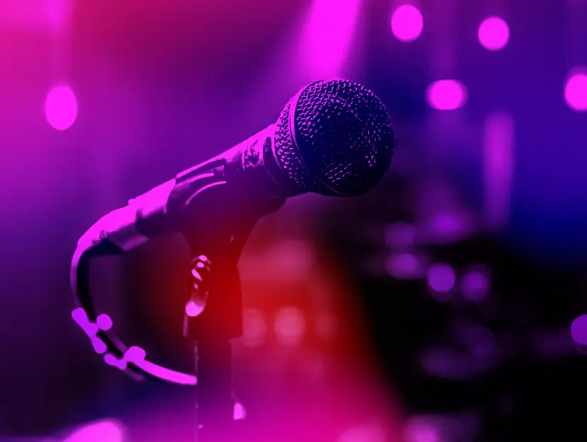 Purple microphone with stage lighting